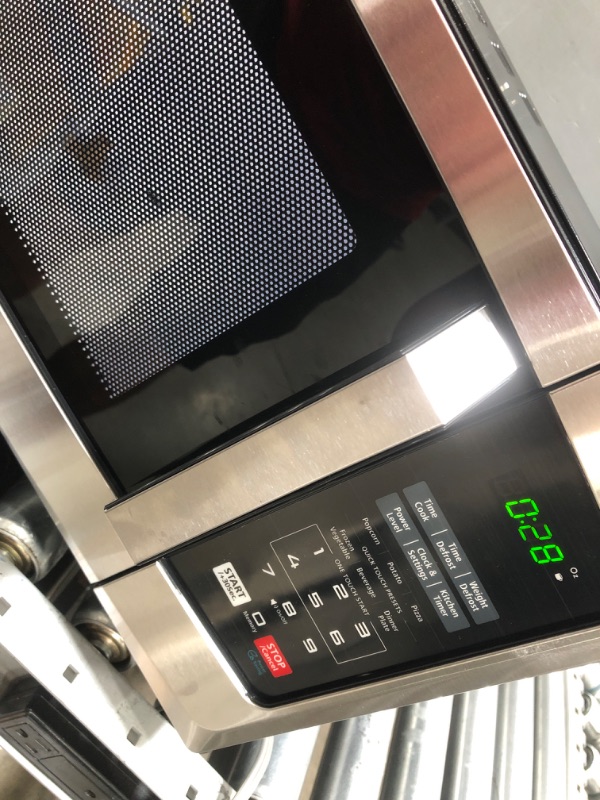 Photo 1 of TOSHIBA EM925A5A-SS Countertop Microwave Oven, 0.9 Cu Ft With 10.6 Inch Removable Turntable, 900W, 6 Auto Menus, Mute Function & ECO Mode, Child Lock, LED Lighting, Stainless Steel