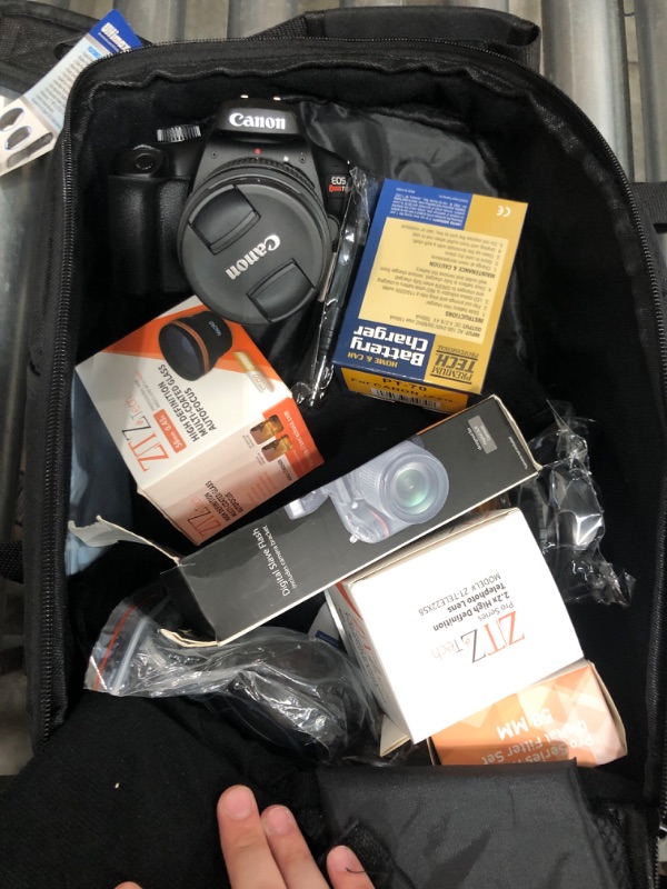 Photo 1 of Canon EOS T100/4000D DSLR Camera with EF-S 18-55mm Lens, SanDisk Memory Card, Tripod, Flash, Backpack + ZeeTech Accessory Bundle (Canon 18-55mm, SanDisk 32GB) (Renewed)LPNPMCS9694458
