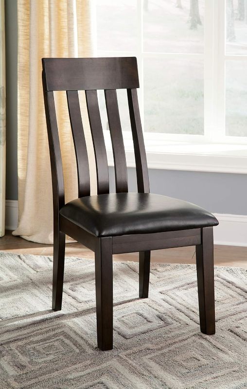 Photo 1 of **LOOSE HARDWARE**Signature Design by Ashley Haddigan Faux Leather Cushioned Rake Back Dining Chair, 2 Count, Dark Brown
