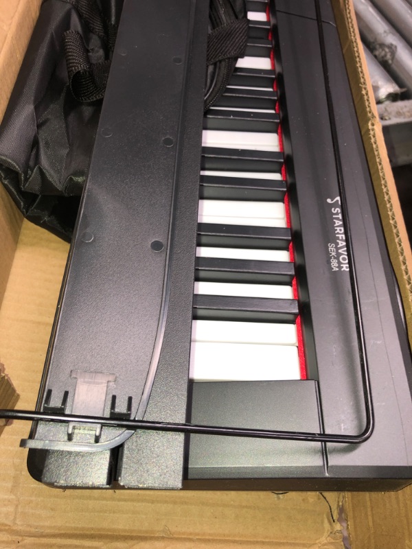 Photo 2 of Starfavor Semi-weighted Piano Keyboard 88 Keys with Stand, Sustain Pedal, and Carrying Case, SEK-88A