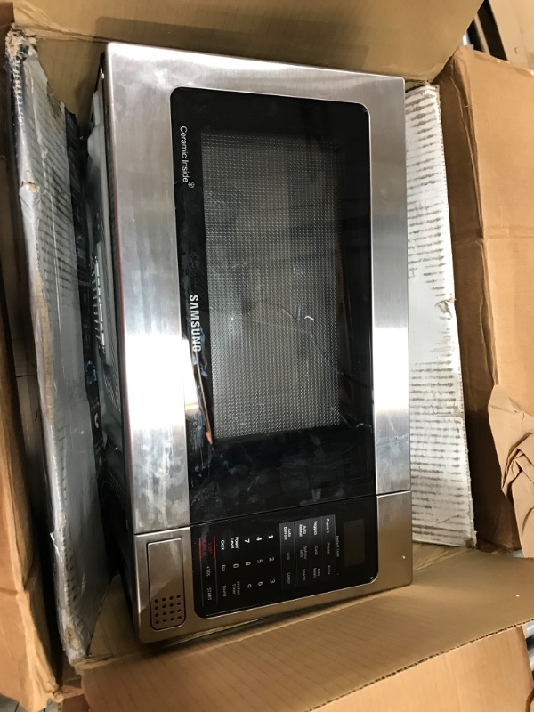 Photo 2 of **MINOR DENTS**SAMSUNG 1.1 Cu Ft Countertop Microwave Oven w/ Grilling Element, Ceramic Enamel Interior, Auto Cook Options,1000 Watt, MG11H2020CT/AA, Stainless Steel, Black w/ Mirror Finish,15.8"D x 20.4"W x 11.7"H
