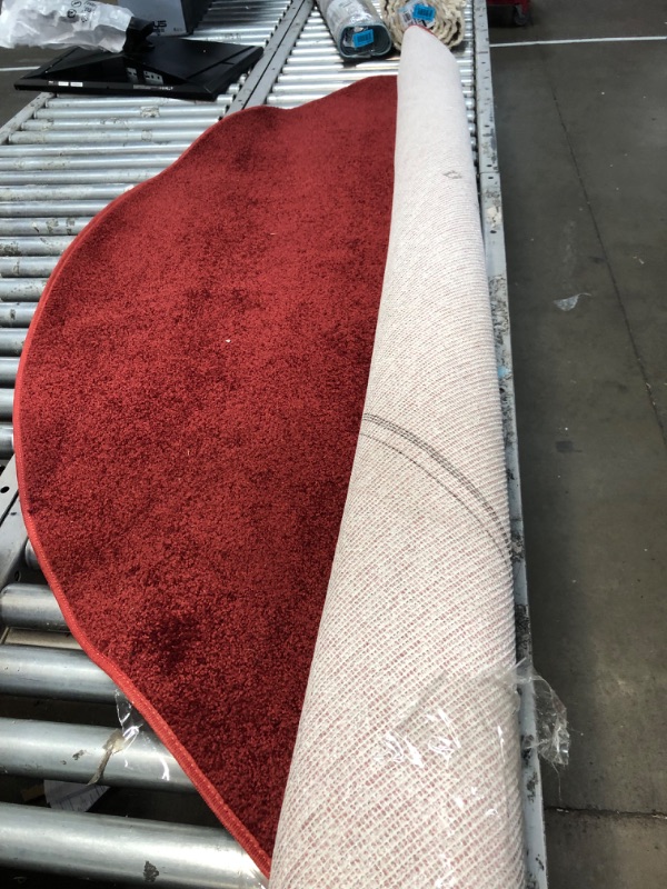 Photo 1 of 8in round red area rug **unbranded