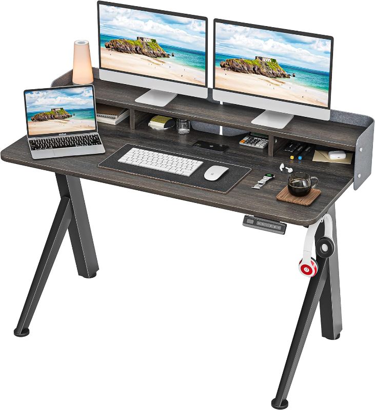 Photo 1 of SOMEET Electric Height Adjustable Standing Desk, 48''x24'' Stand Up Desk with Double Drawers, R Shape Sit Stand Rising Desk with Monitor Stand, Home Office Ergonomic Computer Workstation, Black Walnut
