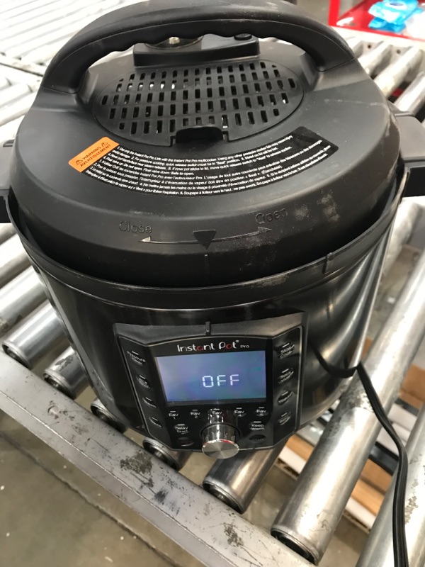 Photo 2 of (USED AND MISSING PRESSURE PIPES) Instant Pot Pro 10-in-1 Pressure Cooker, Slow Cooker, Rice/Grain Cooker, Steamer, Sauté, Sous Vide, Yogurt Maker, Sterilizer, and Warmer, Includes App With Over 800 Recipes, Black, 8 Quart 8QT Pro