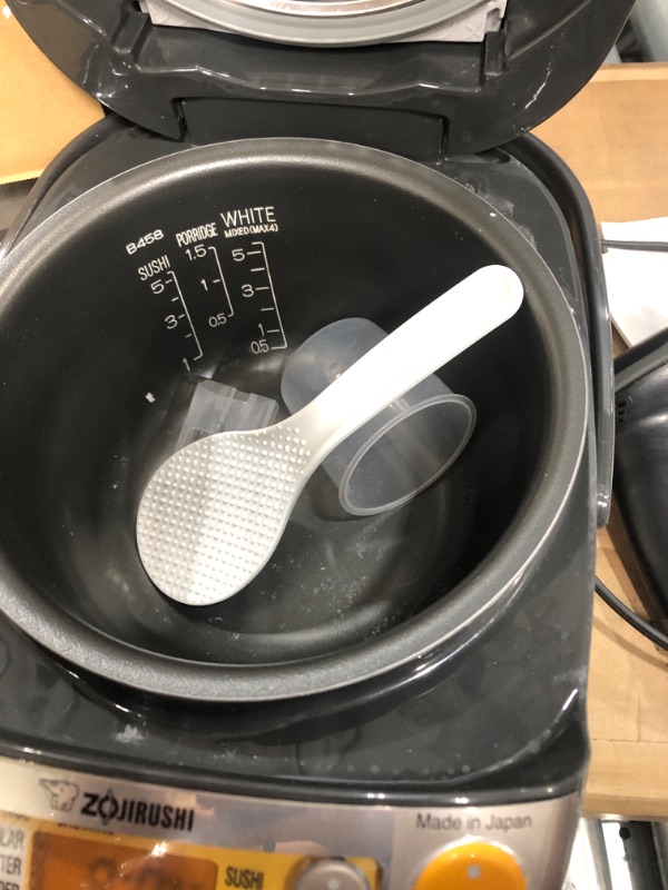Photo 3 of * powers on * used item *
Zojirushi NP-HCC10XH Induction Heating System Rice Cooker and Warmer, 1 L, Stainless Dark Gray Stainless Dark Gray 1 L