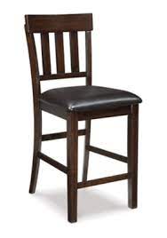 Photo 1 of **ONE CHAIR BROKEN** Ashley Haddigan Counter Height Bar Stool (Set of 2) Leather, Dark Brown
