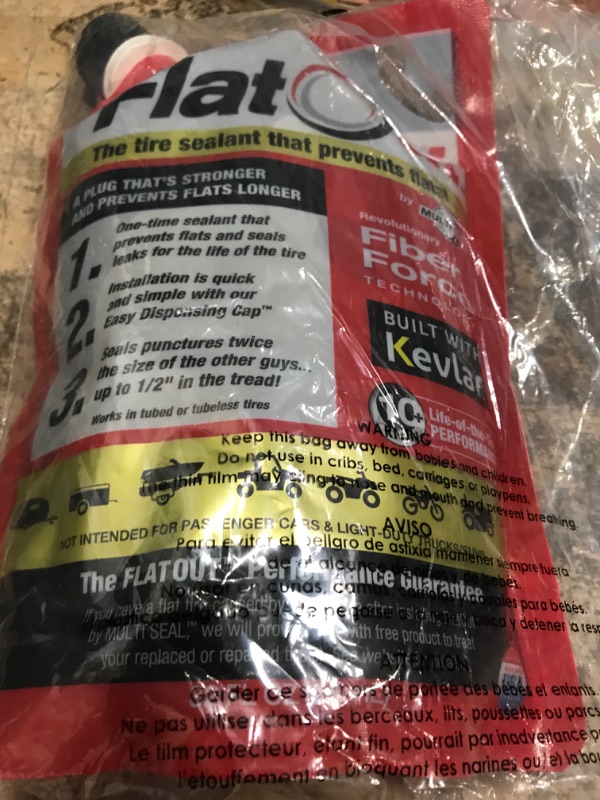 Photo 2 of FlatOut Multi-Purpose Tire Sealant - Prevents and Repairs Flat Tires, Seals Leaks, Contains Kevlar, 32-Ounce Bag, 1-Pack 1-Pack (32 oz. Tire Sealant)