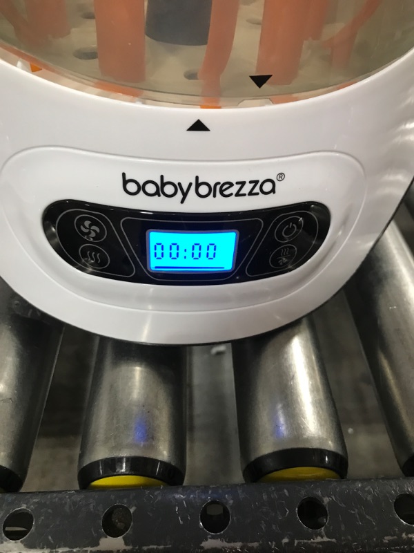 Photo 2 of Baby Brezza Baby Bottle Sterilizer and Dryer Machine – Electric Steam Sterilization - Universal Fit - Pacifiers, Glass, Plastic, and Newborn Feeding Bottles--box damaged