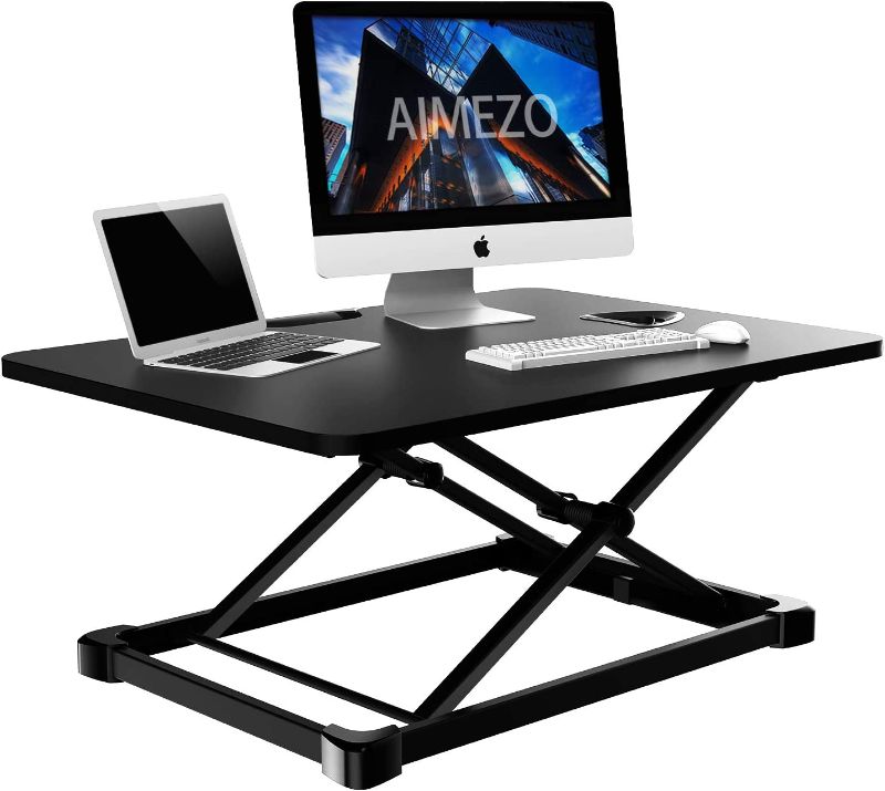 Photo 1 of Height Adjustable Standing Desk Converter, Standing Desk Converter,Sit-Stand Desk Riser with Gas Spring Riser Table for Standing or Sitting Fully Assembled