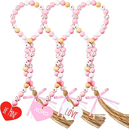 Photo 1 of 3 Pieces Valentine's Day Wood Bead Garlands with Tassels Hanging Wooden Love Heart Ornaments Farmhouse Rustic Beads for Tiered Tray Decorations Valentine's Day Decor (Pink White Mix)