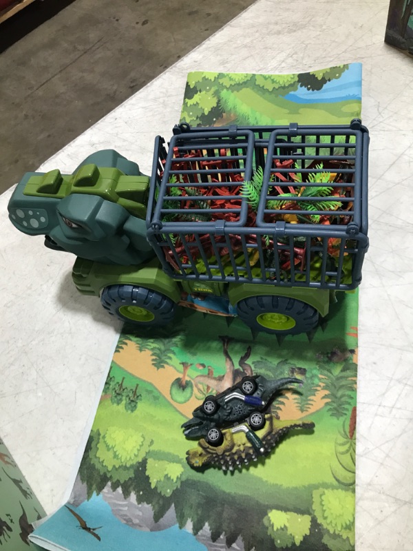 Photo 2 of Dinosaur Truck Toys for 3 4 5 6 7 Year Old Boys, 42 in 1 Kids Toys Carrier Truck Car Toys with Dinosaur Toys for Kids 3-5 5-7, Pull Back Cars, Activity Playmat, Car Playset Christmas Birthday Gifts Green Tyrannosaurus