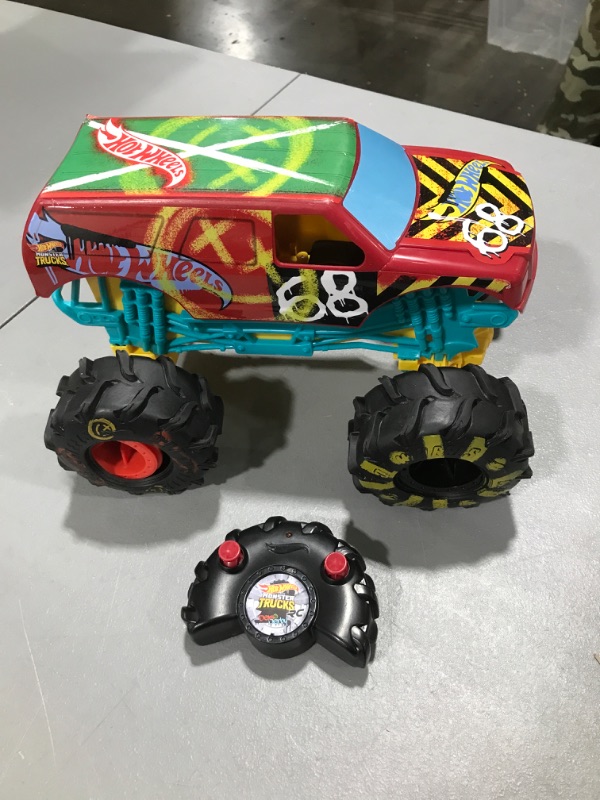 Photo 2 of ?Hot Wheels RC Monster Trucks 1:15 Scale HW Demo Derby, 1 Remote-Control Toy Truck with Terrain Action Tires, Toy for Kids 4 Years Old & Older
