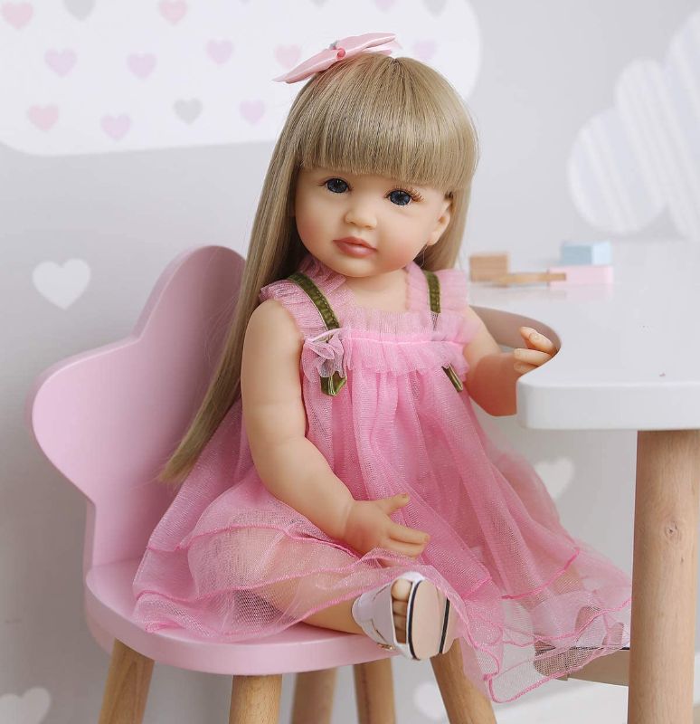 Photo 1 of  RXDOLL Reborn Baby Dolls Full Body Silicone Vinyl Girl 22 inch 55 cm Realistic Lifelike Toddlers Newborn Baby Doll Waterproof with Blond Long Hair Pink Dress for Girls Birthday Xmas Gifts 