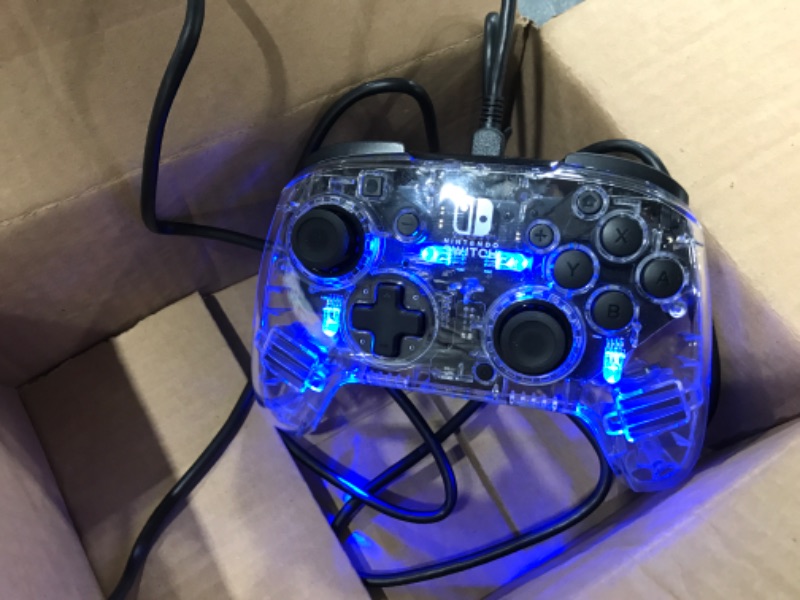 Photo 2 of Afterglow Deluxe+ LED Wired Gaming Controller - Licensed by Nintendo for Switch and OLED - RGB Hue Color Lights - See through Gamepad Controller - 3.5mm Jack - Dual Vibration - Paddle Buttons
