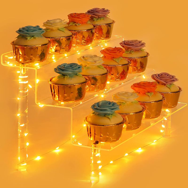 Photo 1 of Acrylic Display Riser, 3 Tier POP Firgures Cupcake Display Stand, Clear Risers for Perfume, Dessert, Glassware,Cosmetic with Yellow Light for Party, Wedding, Birthday, Anniversary. https://a.co/d/dvIUqTw