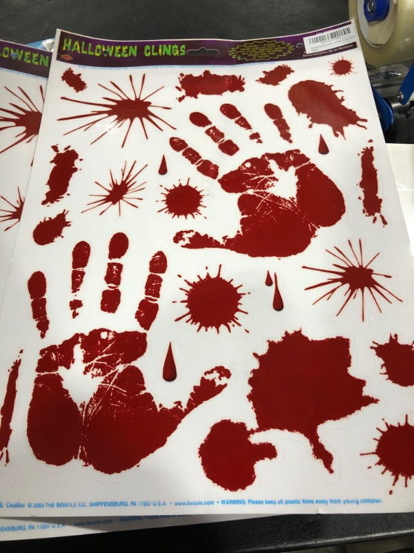 Photo 2 of Beistle Bloody Handprint Clings, 12-Inch by 17-Inch Sheet Window Decor