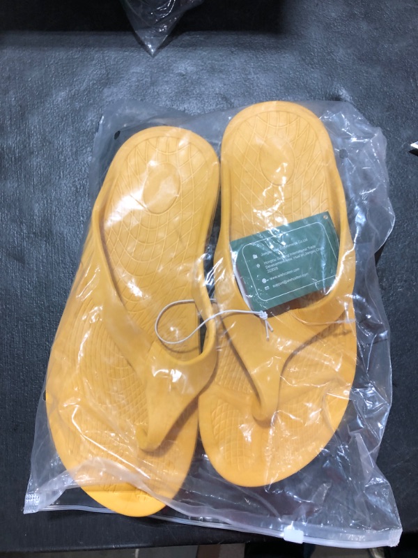 Photo 2 of YELLOW AND BLACK FLIP FLOPS SIZE 9-10 