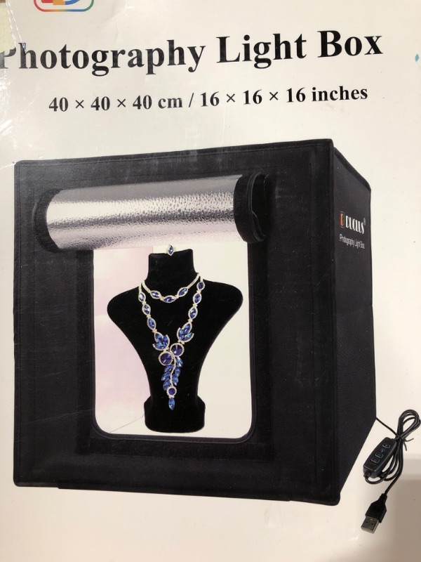 Photo 1 of  Portable Photo Studio Light Box,12"x12" Professional Dimmable Shooting Tent Kit with 112 LED Lights & 6 Backdrops for Jewelry and Small Items Product Photograph