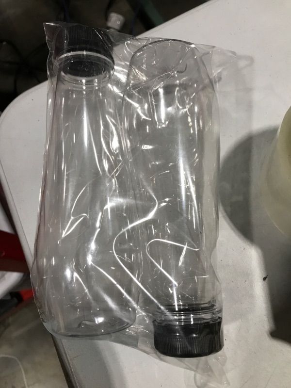 Photo 2 of PLASTIC BOTTLE WITH CAP 6-8 OZ PAIR