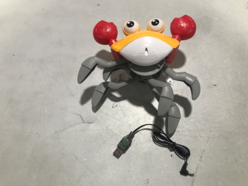 Photo 2 of HUT Crawling Crab Baby Toy with Light Up for Kids Toddlers, Musical Toy with Automatically Avoid Obstacles, Sensory Walking Crab Toy for Kids, Tummy Time Crab Pet Toy Gift 