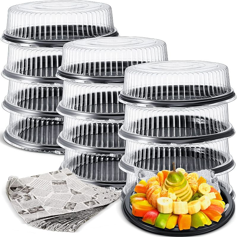Photo 1 of 12 Pack Heavy Duty, Repeatedly 16 Inch Plastic Serving Tray with Lid and 24 Pcs Deli Wax Paper Sheets Sets Large Plastic Party Platters with Clear Lids Stackable Round Food Serving Trays for Party

