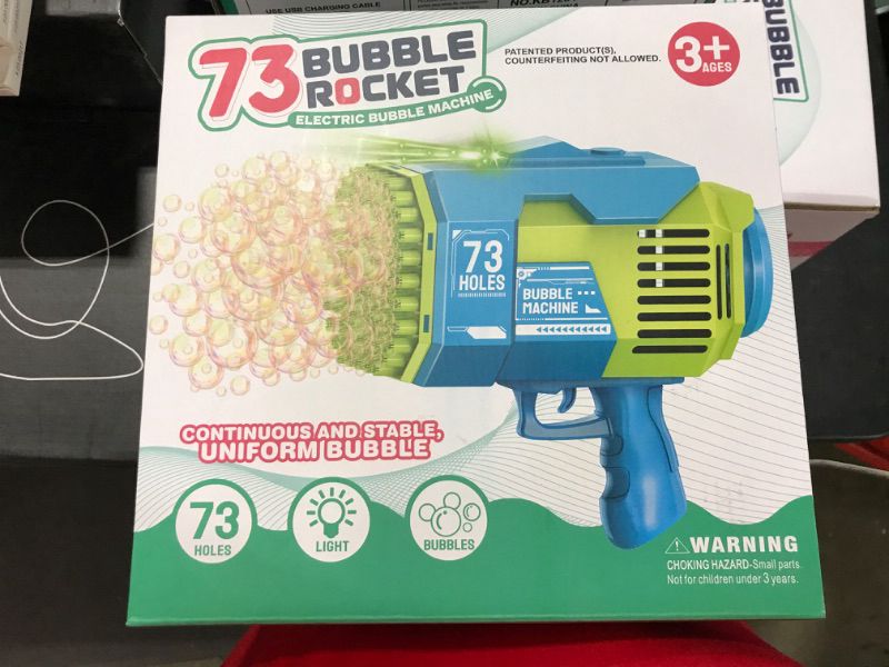 Photo 1 of Bubble Gun with 73-Hole and Light, Summer Indoor Outdoor Activity Bubble Blaster Party Favors Electric Automatic Bubble Maker Machine (Light Blue)