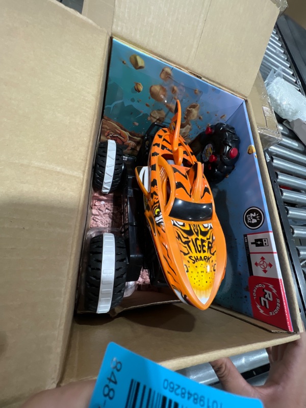 Photo 2 of Hot Wheels Monster Trucks, Remote Control Car, Monster Truck Toy with All-Terrain Wheels, 1:15 Scale Unstoppable Tiger Shark RC