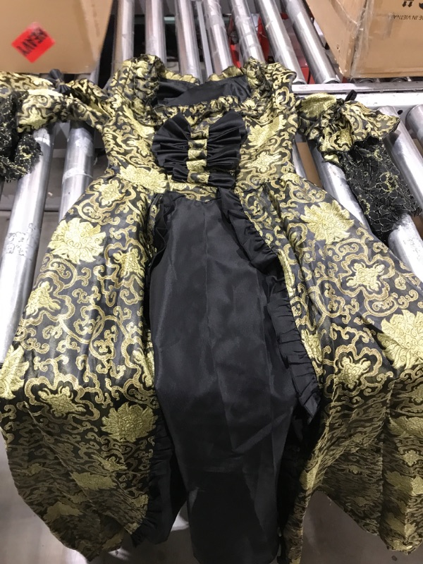 Photo 1 of black and gold dress, size XS.