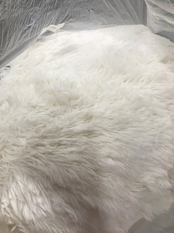 Photo 1 of LARGE WHITE NON-SLIP FAUX FUR RUG EXACT SIZE UNKNOWN