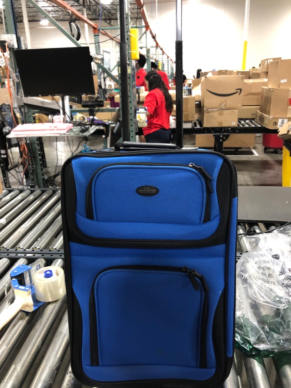 Photo 2 of 20x14x7in blue bag with wheels and retractable handle