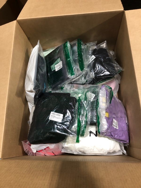 Photo 1 of Box lot of new and used clothing and shoes for men, women, and kids. Sold as is.