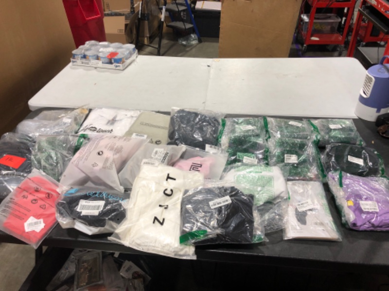 Photo 1 of Box lot of new and used clothing and shoes for men, women, and kids. Sold as is.