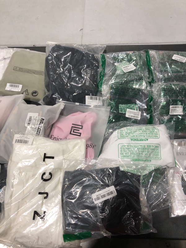 Photo 1 of Box lot of new and used clothing and shoes for men, women, and kids. Sold as is.
