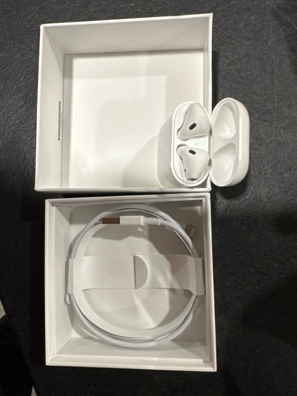 Photo 2 of Apple AirPods with Charging Case (Latest Model)