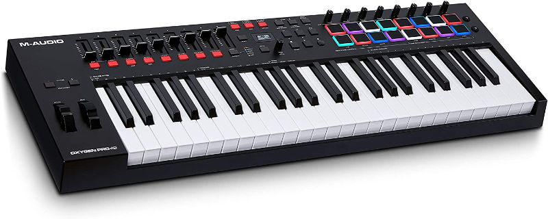 Photo 1 of M-Audio Oxygen Pro 49 – 49 Key USB MIDI Keyboard Controller With Beat Pads, MIDI assignable Knobs, Buttons & Faders and Software Suite Included