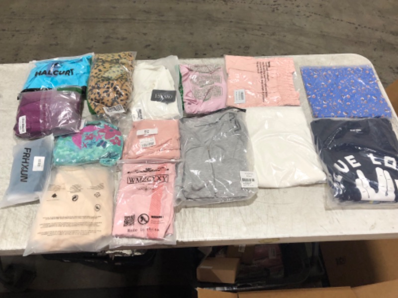 Photo 1 of Box lot of random clothes, new & used, clothes are random sizes and genders
