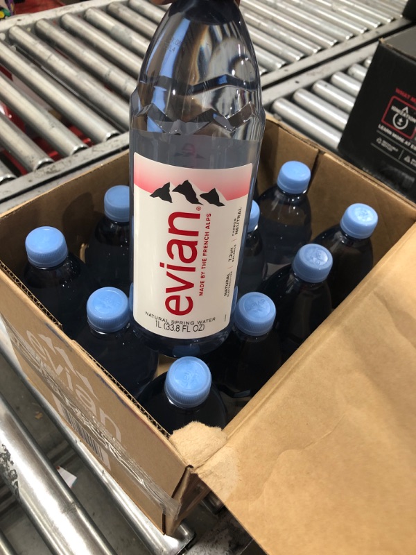 Photo 1 of evian Natural Spring Water, Naturally Filtered Spring Water in Large Bottles, 33.81 Fl Oz (Pack of 12)