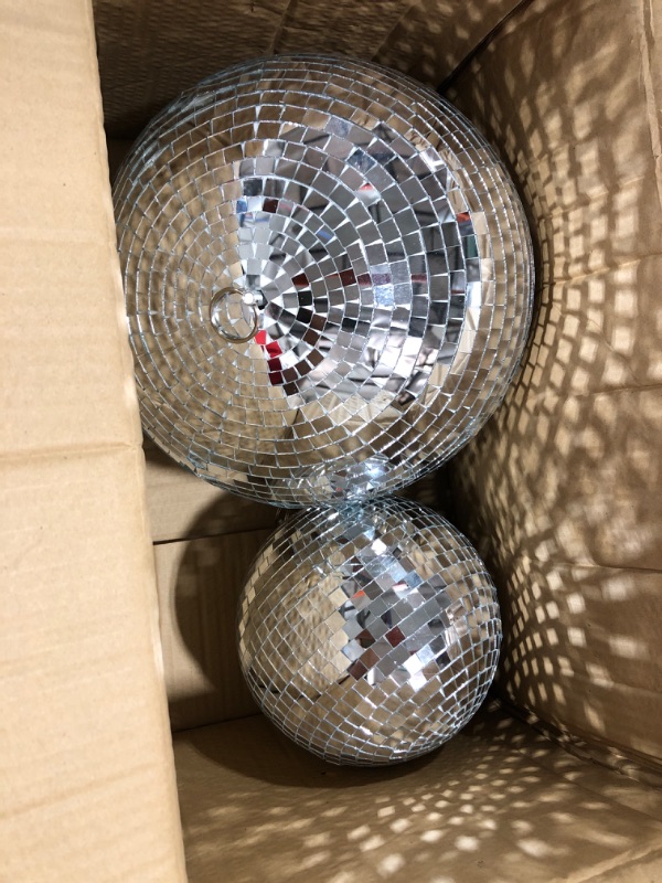 Photo 2 of 2 Pack Large Disco Ball Silver Hanging Mirror Disco Ball Reflective Mirror Disco Ball Ornament for Party Holiday Wedding Dance Music Festivals Decor Club Stage Props DJ Decoration (8 Inch, 12 Inch)