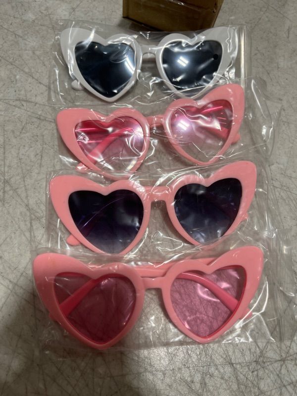 Photo 1 of AOOFFIV Heart Shape Sunglasses Rimless Transparent Candy Color Heart Glasses Love Eyewear Party Favors - 4 