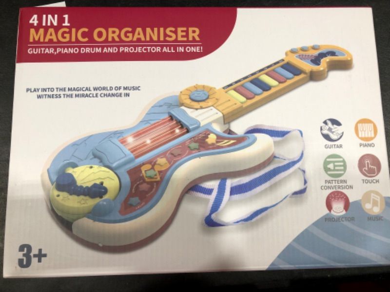 Photo 1 of 4 IN 1 MAGIC ORGANISER- GUITAR, PIANO, DRUM AND PROJECTOR ALL IN ONE!