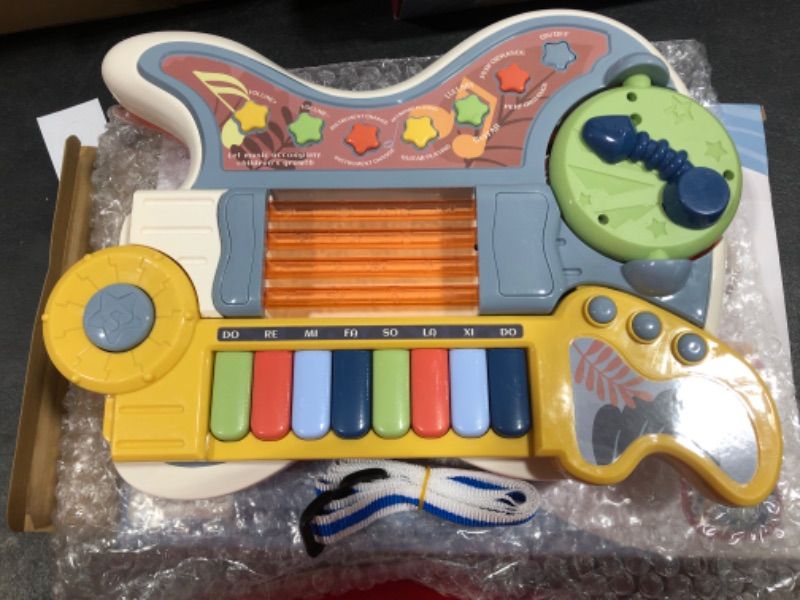 Photo 1 of 4 IN 1 MAGIC ORGANISER- GUITAR, PIANO, DRUM AND PROJECTOR ALL IN ONE!