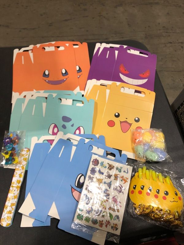 Photo 1 of 60 Pcs Pokemon Themed Party Favors for Kids Birthday Supply-10 Favor boxes ( 2 of each character ) 10 snap bands, 10 charms, 10 squishies, sticker sheets 

