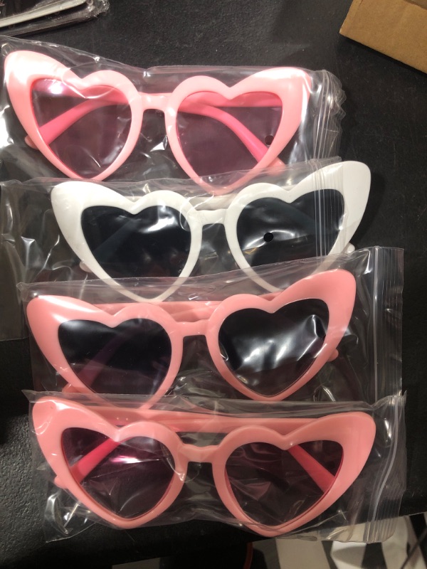 Photo 1 of AOOFFIV Heart Shape Sunglasses Rimless Transparent Candy Color Heart Glasses Love Eyewear Party Favors(8805-4ps white 3*pink
