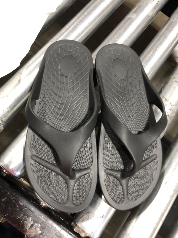 Photo 1 of 2 pairs of flip flops