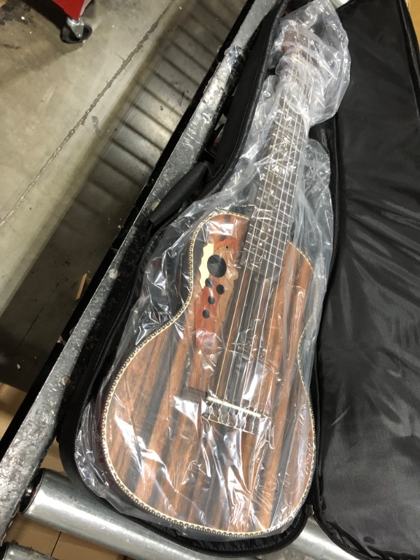 Photo 1 of Caramel 6 String CB103G 30 Inch High Gloss Zebra Wood Acoustic & Electric Ukulele Guitalele with Truss Rod with Padded Gig Bag, Strap and Wall hanger
