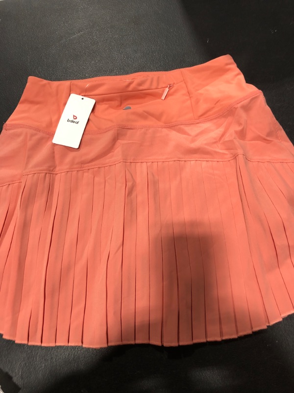 Photo 2 of BALEAF Women's Pleated Tennis Skirts High Waisted Lightweight Athletic Golf Skorts Skirts with Shorts Pockets Scorched Red Coral Small