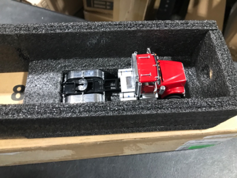 Photo 2 of International HX520 Tandem Tractor Red with XL 120 Lowboy Trailer and CAT Caterpillar 12M3 Motor Grader Set of 2 Pieces 1/50 Diecast Models by Diecast Masters 85598