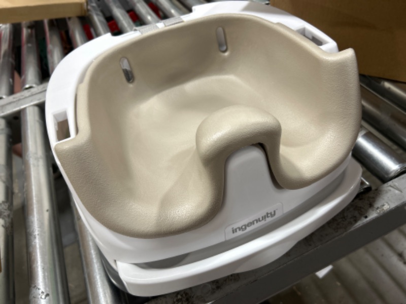 Photo 1 of Ingenuity Baby Base 2-in-1 Booster Feeding & Floor Seat with Self-Storing Tray, Cashmere