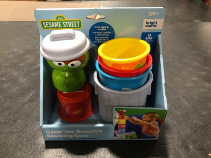 Photo 2 of Bright Starts Sesame Street Oscar the Grouch’s Stacking Cans Stackable Cups, Ages 3-12 months Oscar Stacking Cans