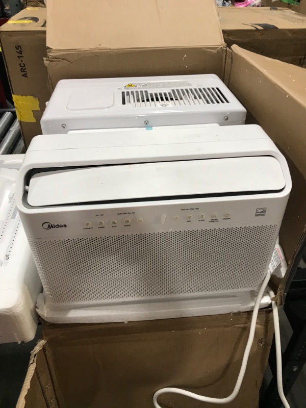 Photo 4 of Midea U Inverter Window Air Conditioner 12,000btu, U-Shaped AC with Open Window Flexibility, Robust Installation,Extreme Quiet, 35% Energy Saving, SMA - minor bent on side of item from pakaging 